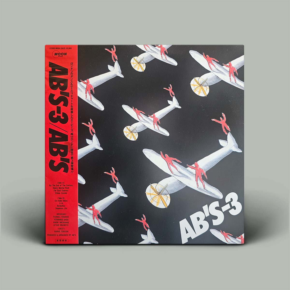Vinyl record cover with airplane design and 'AB'S-3' branding on a gray background