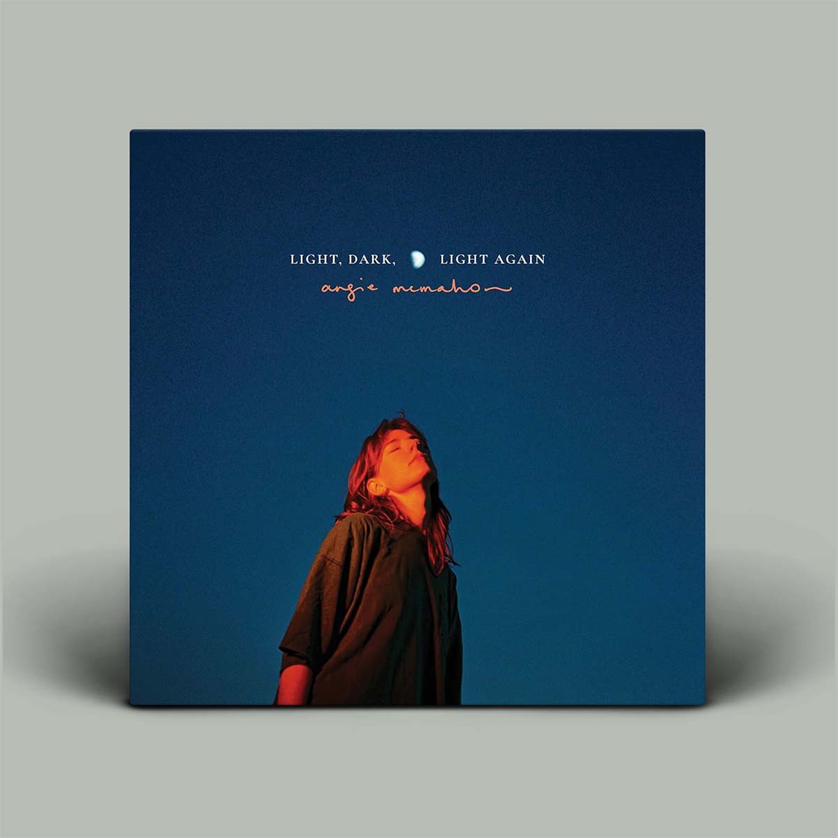 Album cover with portrait on a blue background.