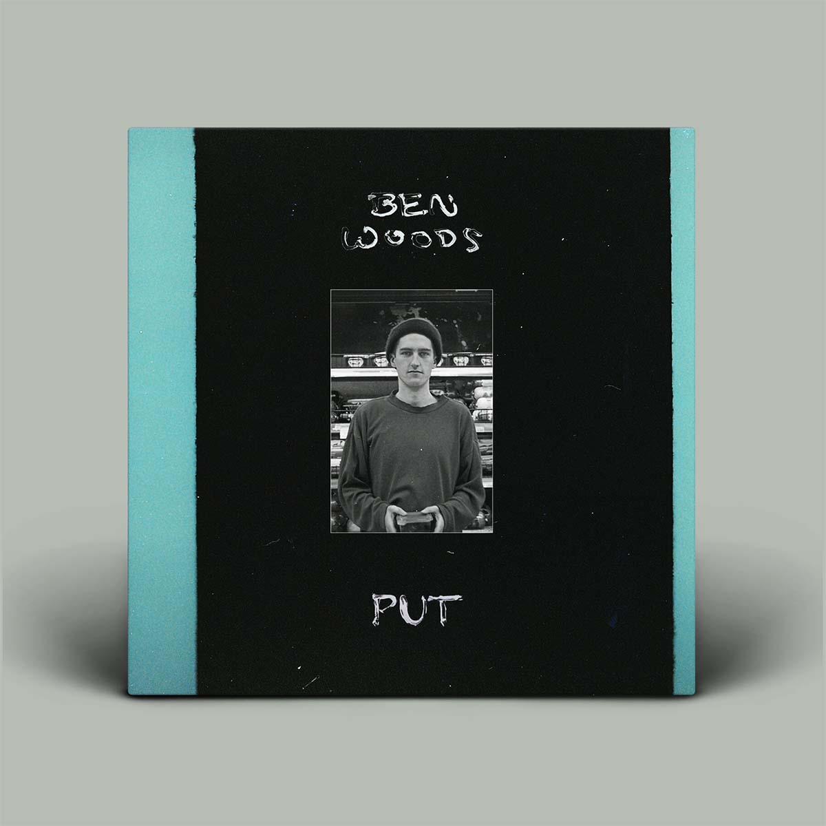 Book cover with a photo of a person and text on a gray background