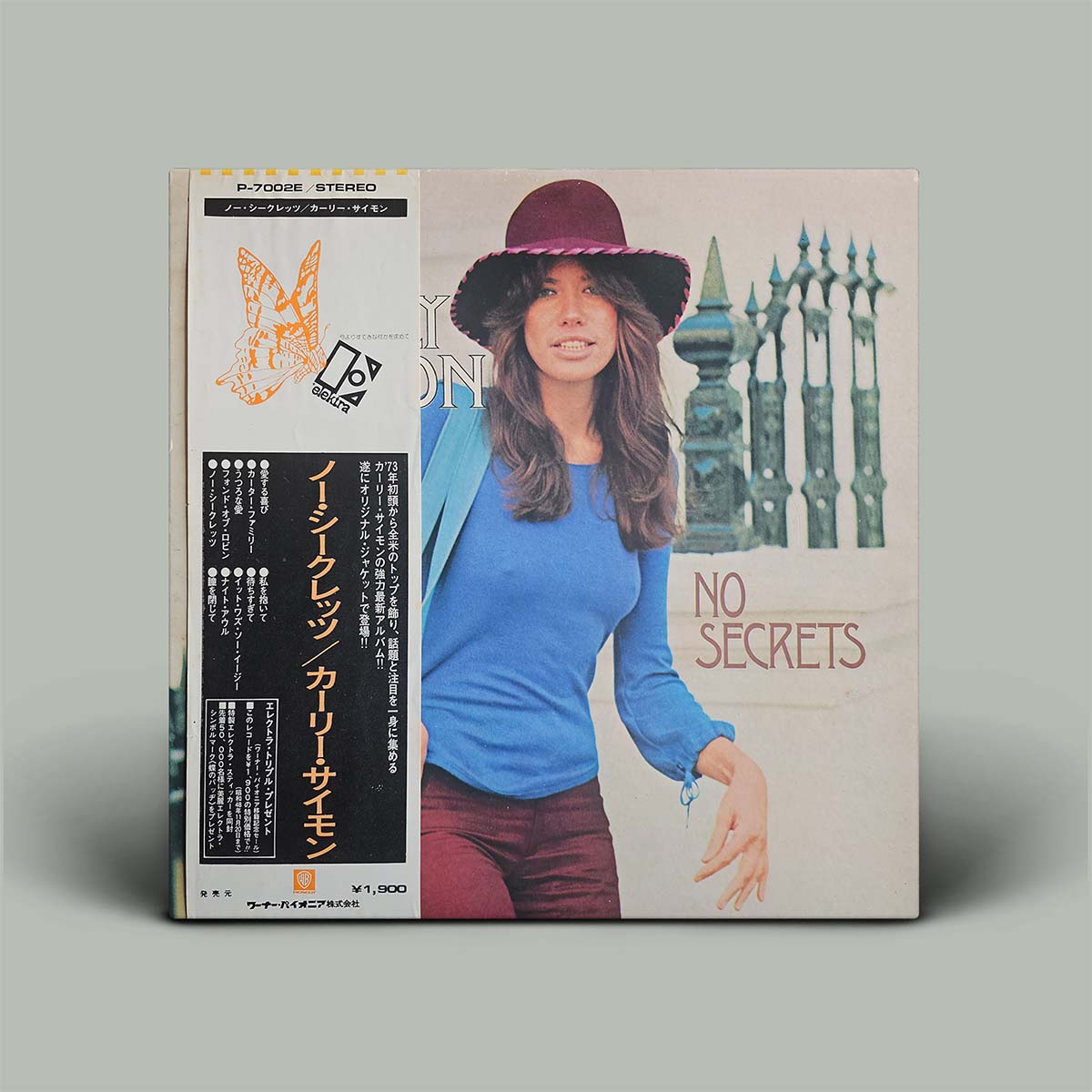 Album cover with photo of woman on cover wearing a hat and the words No Secrets