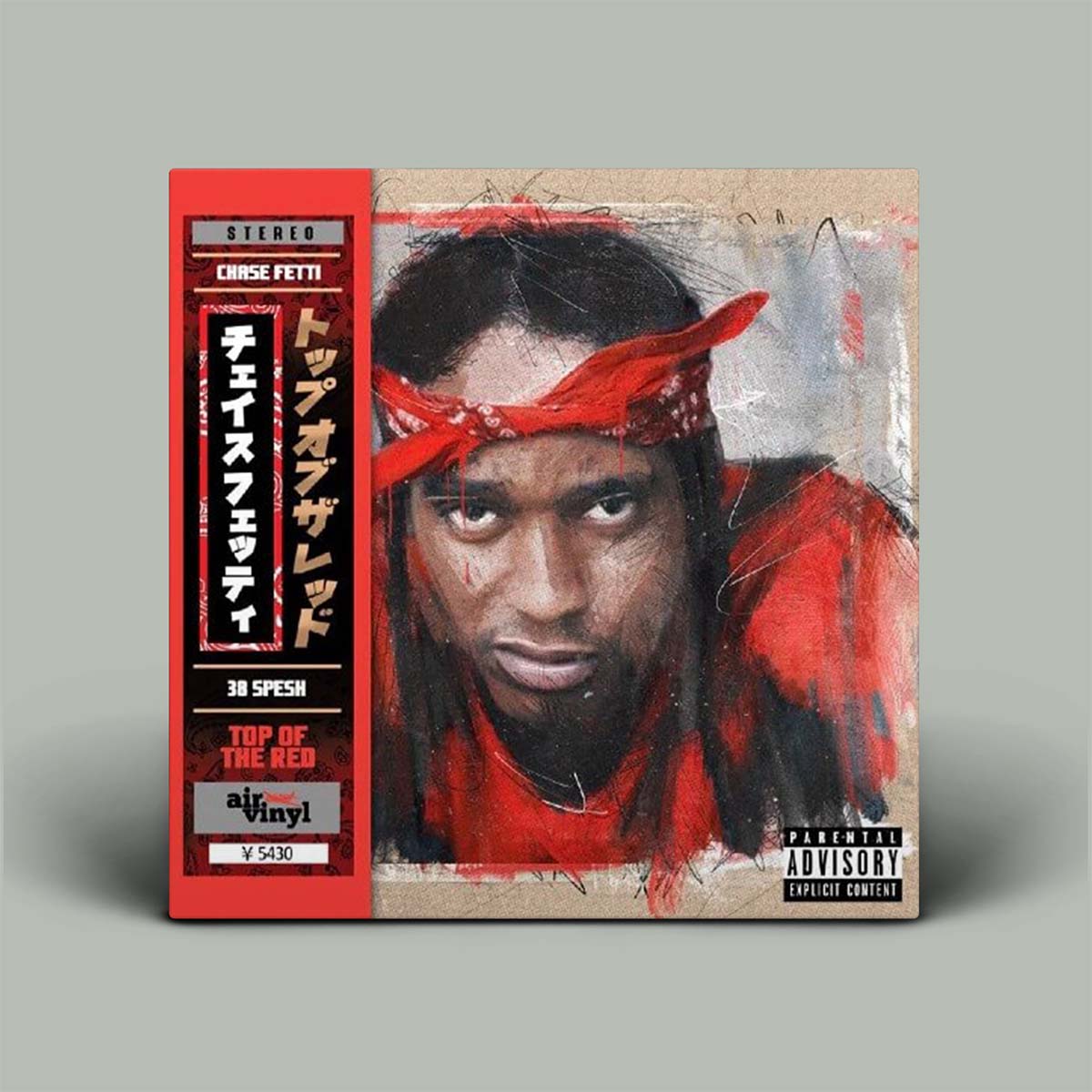 Vinyl record cover with a stylized portrait of a person wearing a red headband on a gray background