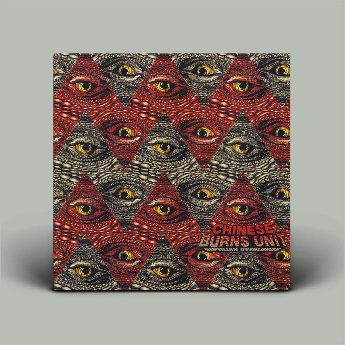 Album cover with eyes on it and red and black zig zag patterns.
