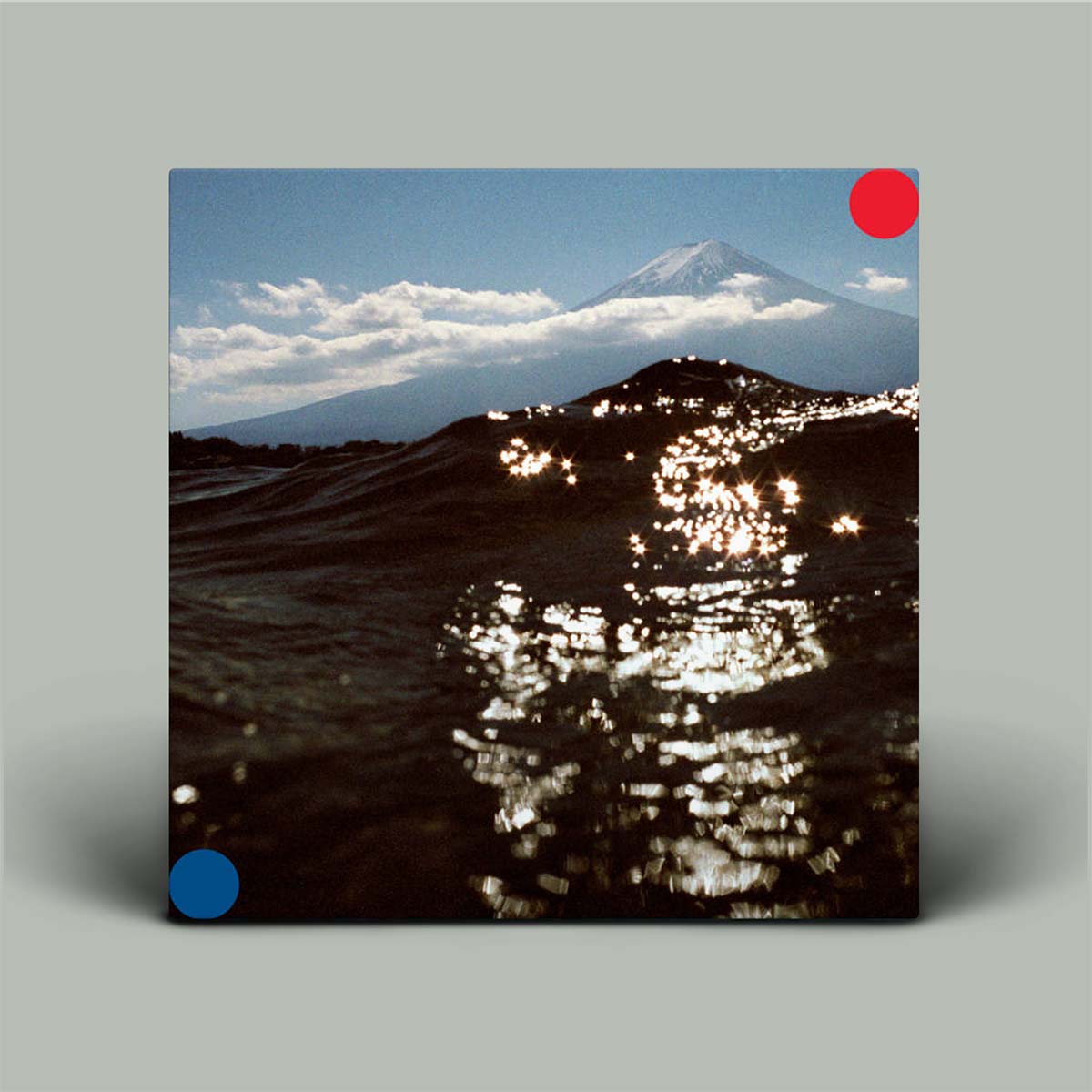 Album cover with mountain and reflective surface design