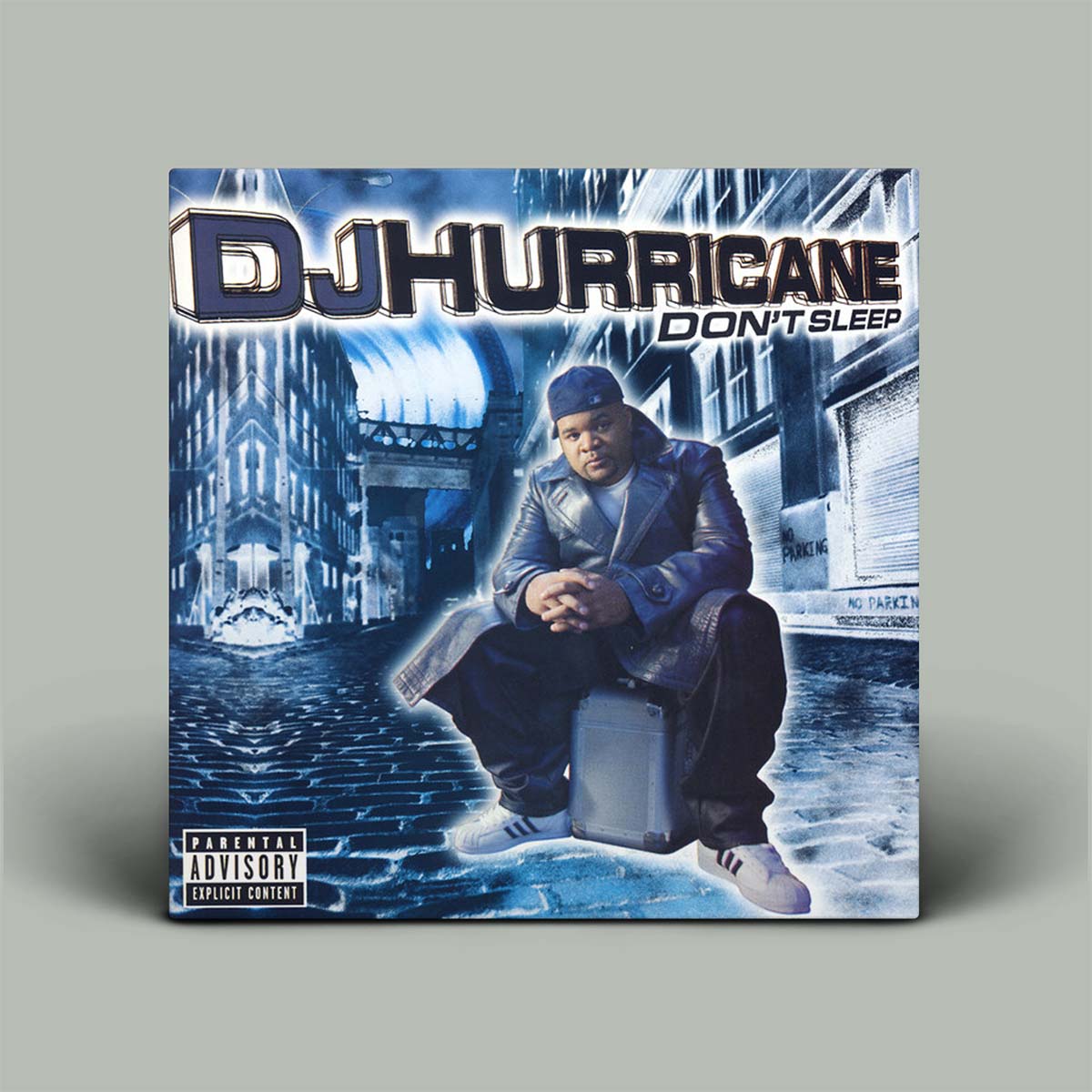 Album cover for 'Don't Sleep' by DJ Hurricane with a person sitting on a suitcase in an urban setting.