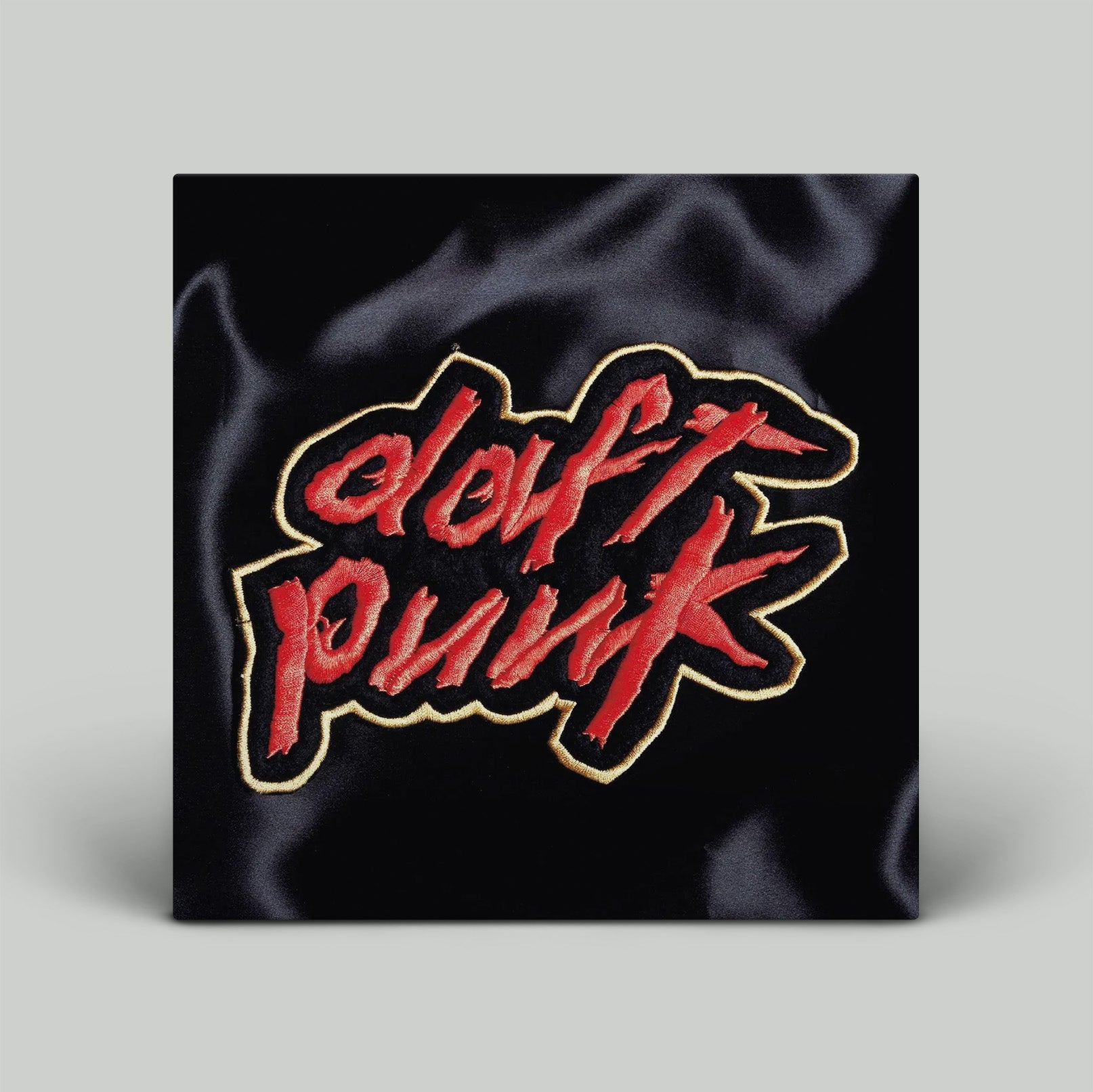 Album cover with 'daft punk' text on black satin fabric