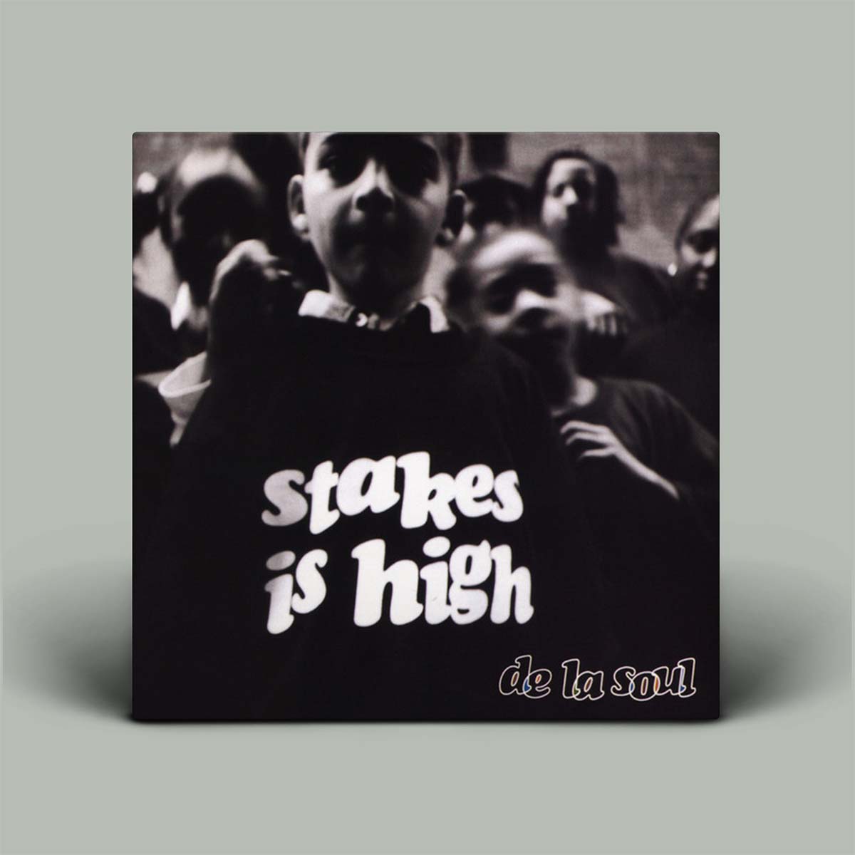 Album cover for 'Stakes Is High' by De La Soul with black and white text on a gray background