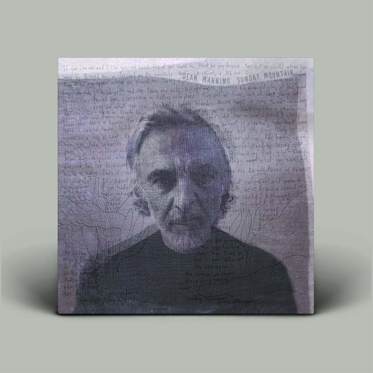 Square album cover with a portrait and text on a gray background