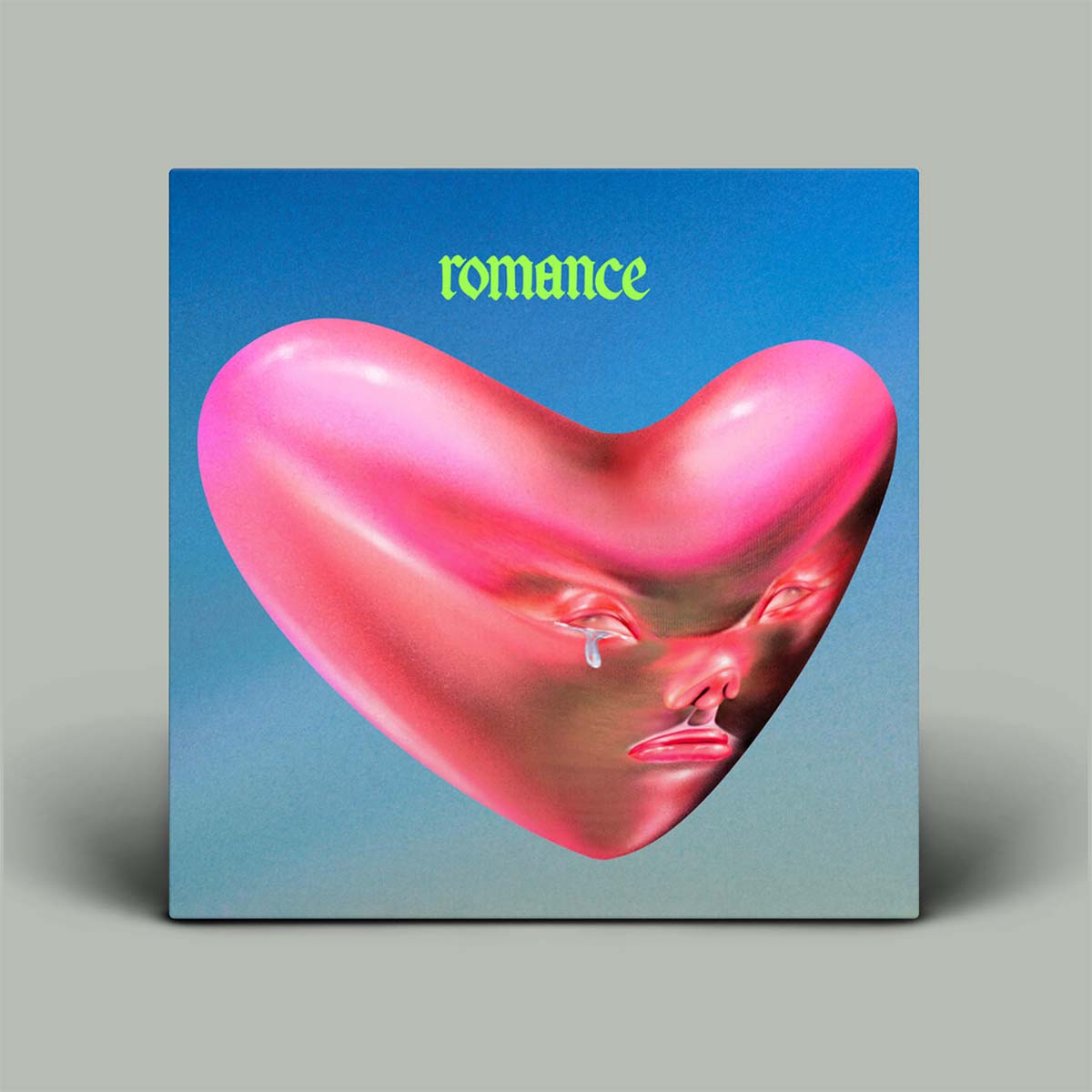 Album cover with blue background, the word romance top-middle and a pink heart with crying face in the centre.