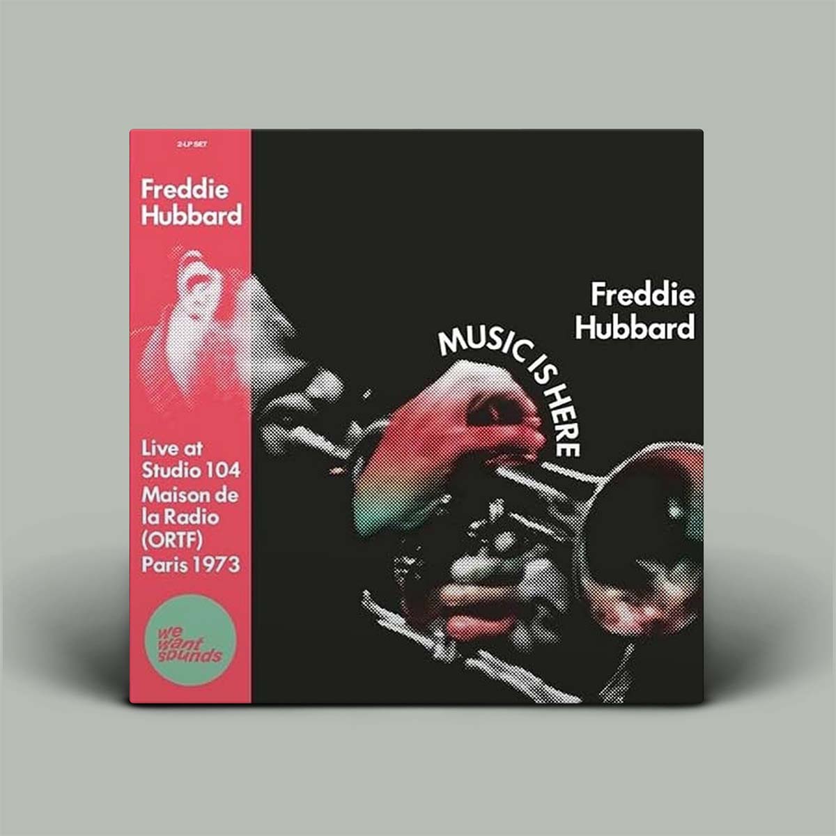 Album cover for Freddie Hubbard's 'Music Is Here' with a pink and black design.