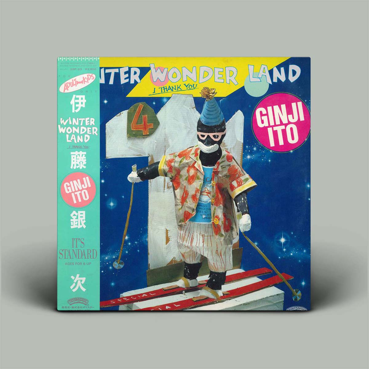 Album cover with a character on skis against a blue background, featuring text and logos.