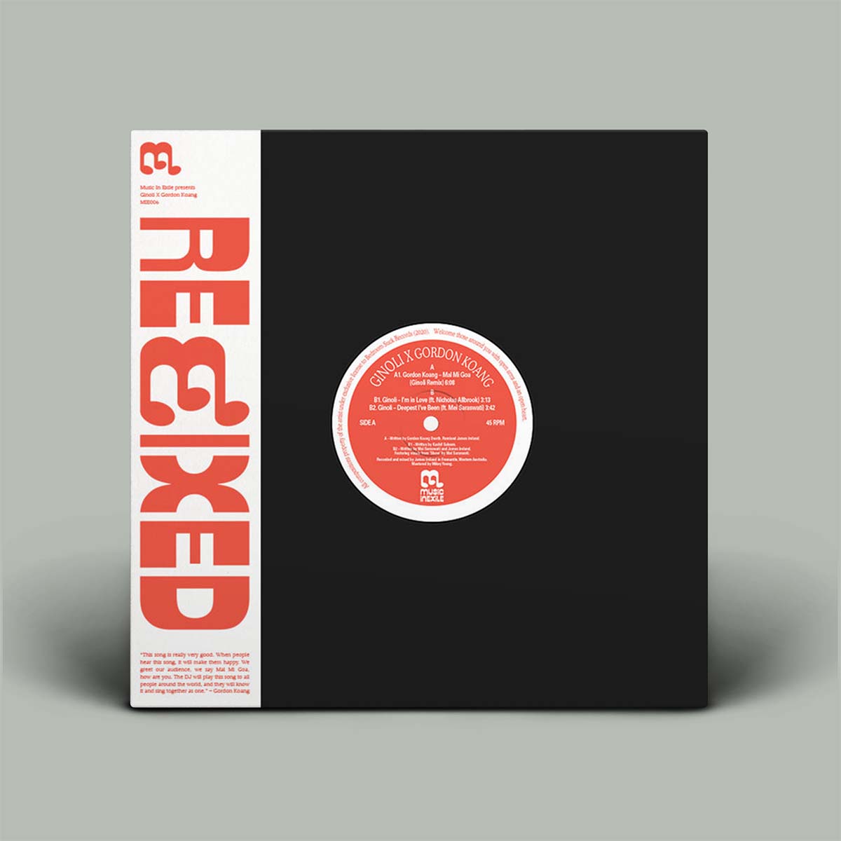 Vinyl record with black cover and red label on a gray background
