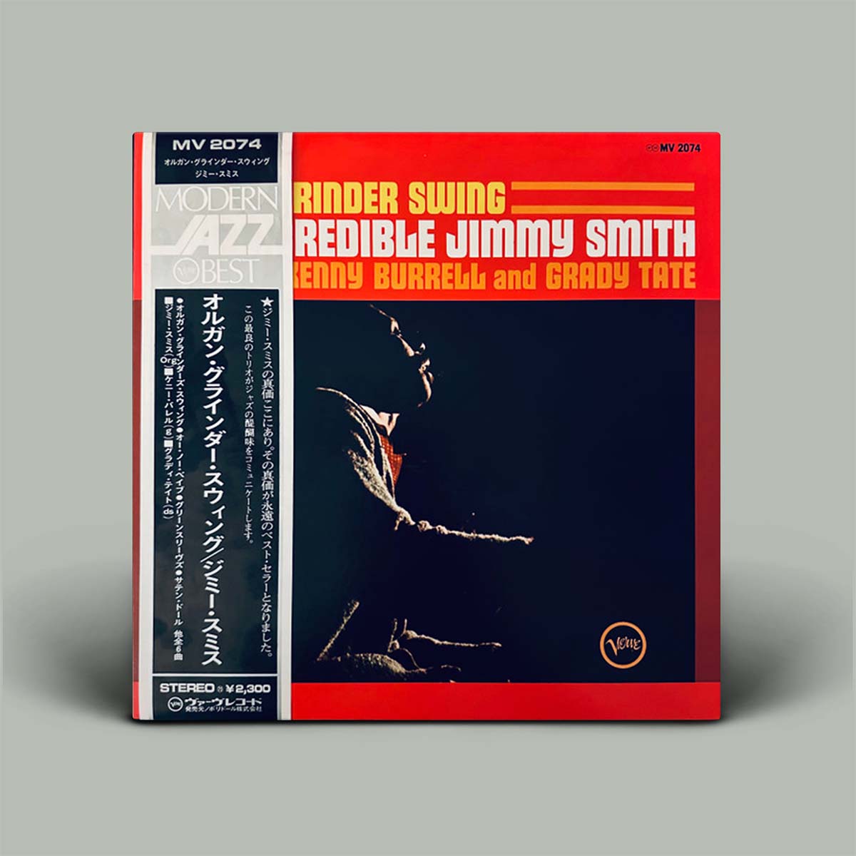 Vinyl record cover with red and black design featuring text and musician's silhouette.