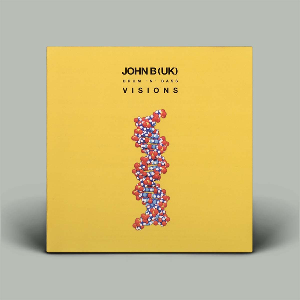 Album cover with yellow background and helix image in the centre.