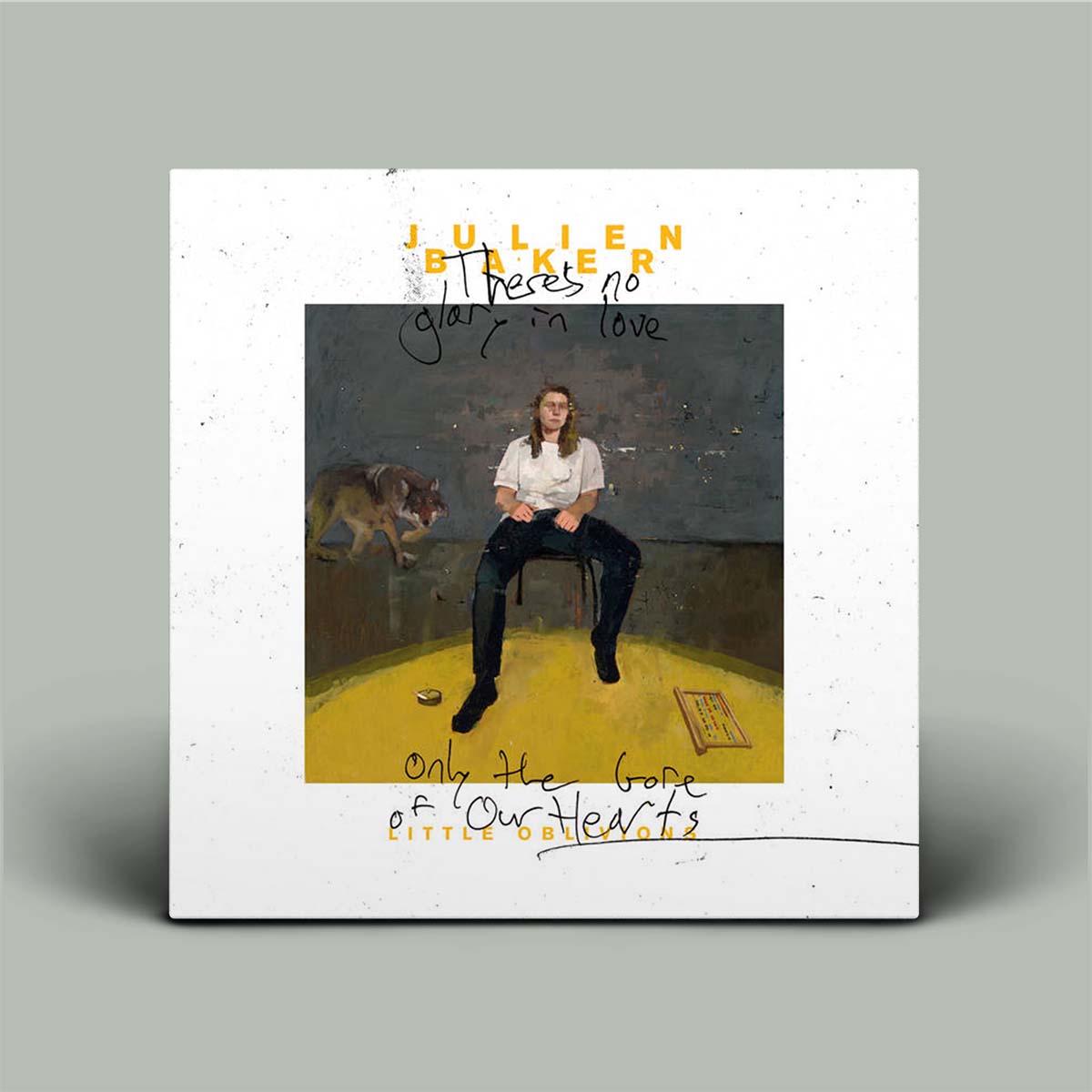 Album cover with a person sitting on a chair, a dog, and text on a gray background
