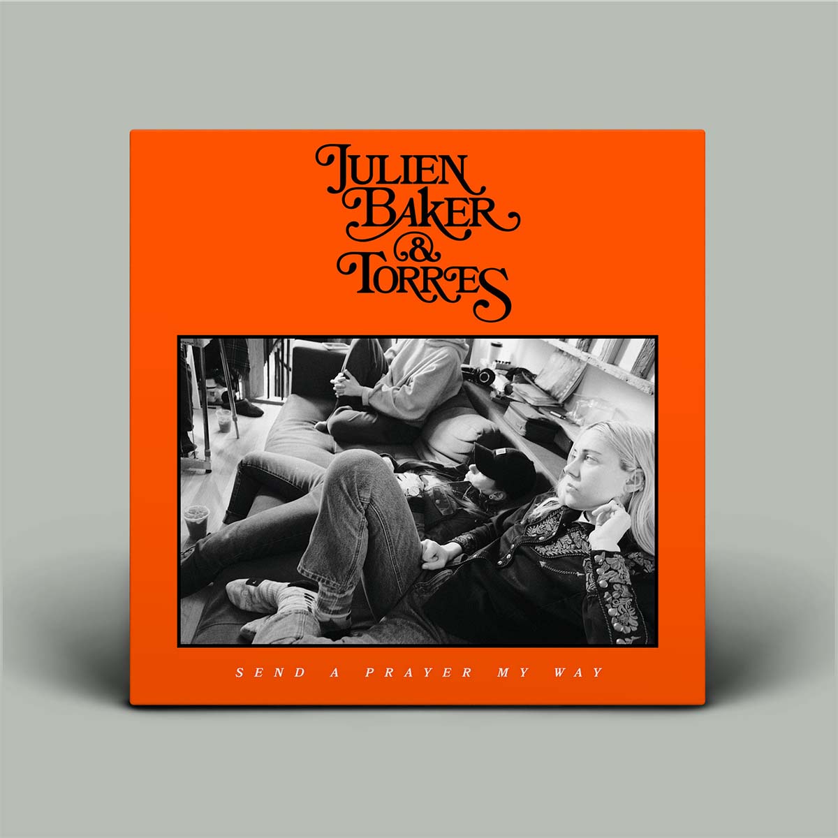 Album cover with 'Julien Baker & Torres' and 'Send a Prayer My Way' text on an orange background.