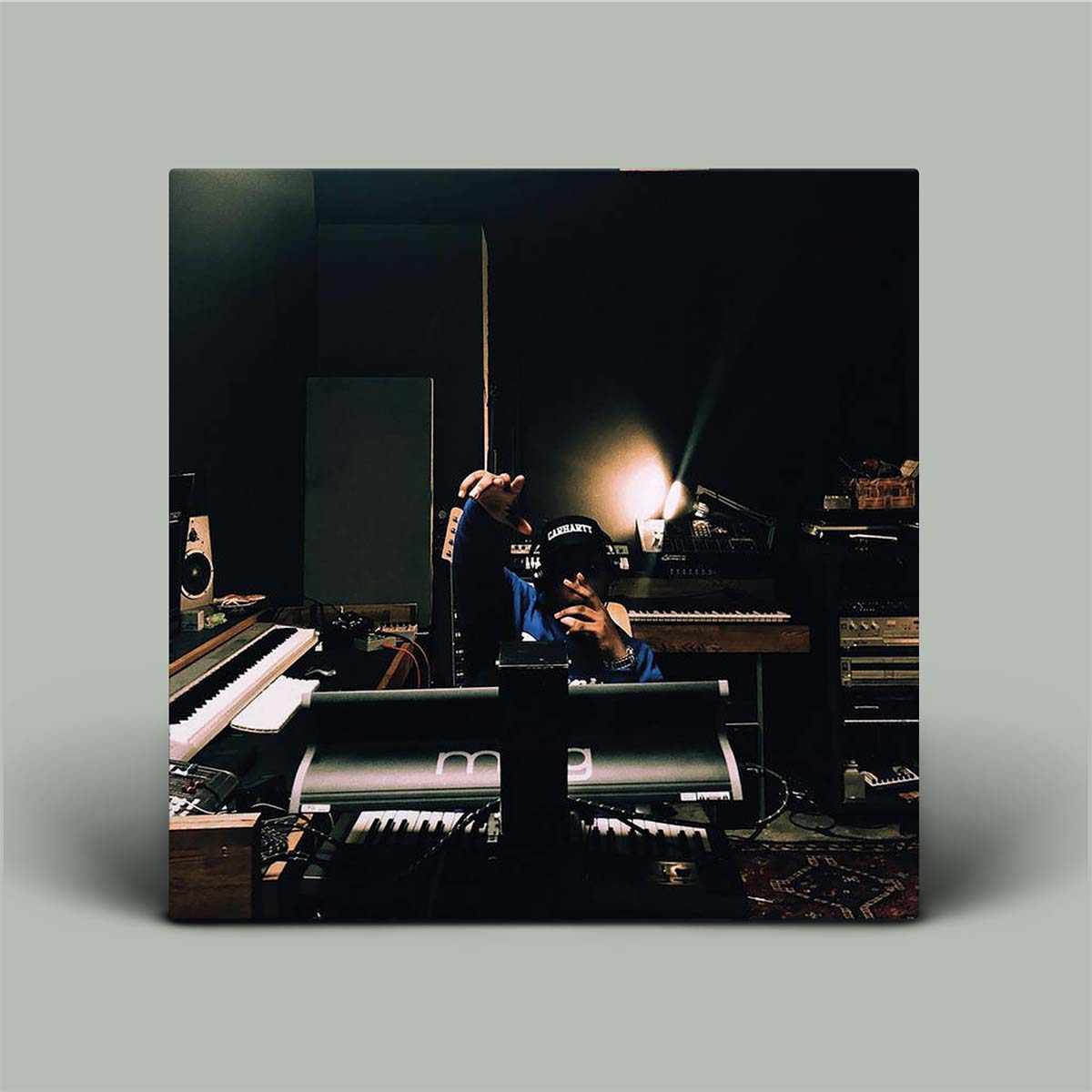 Person in a music studio with electronic equipment