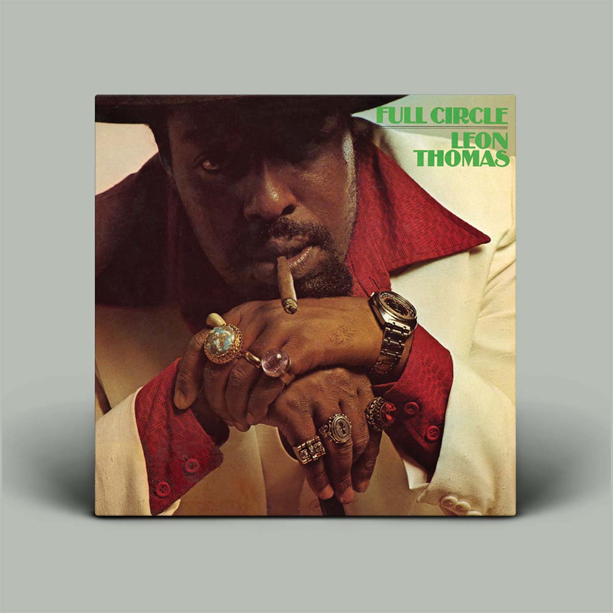 Album cover featuring a person with jewelry and a cigarette, with 'Full Circle Leon Thomas' text.