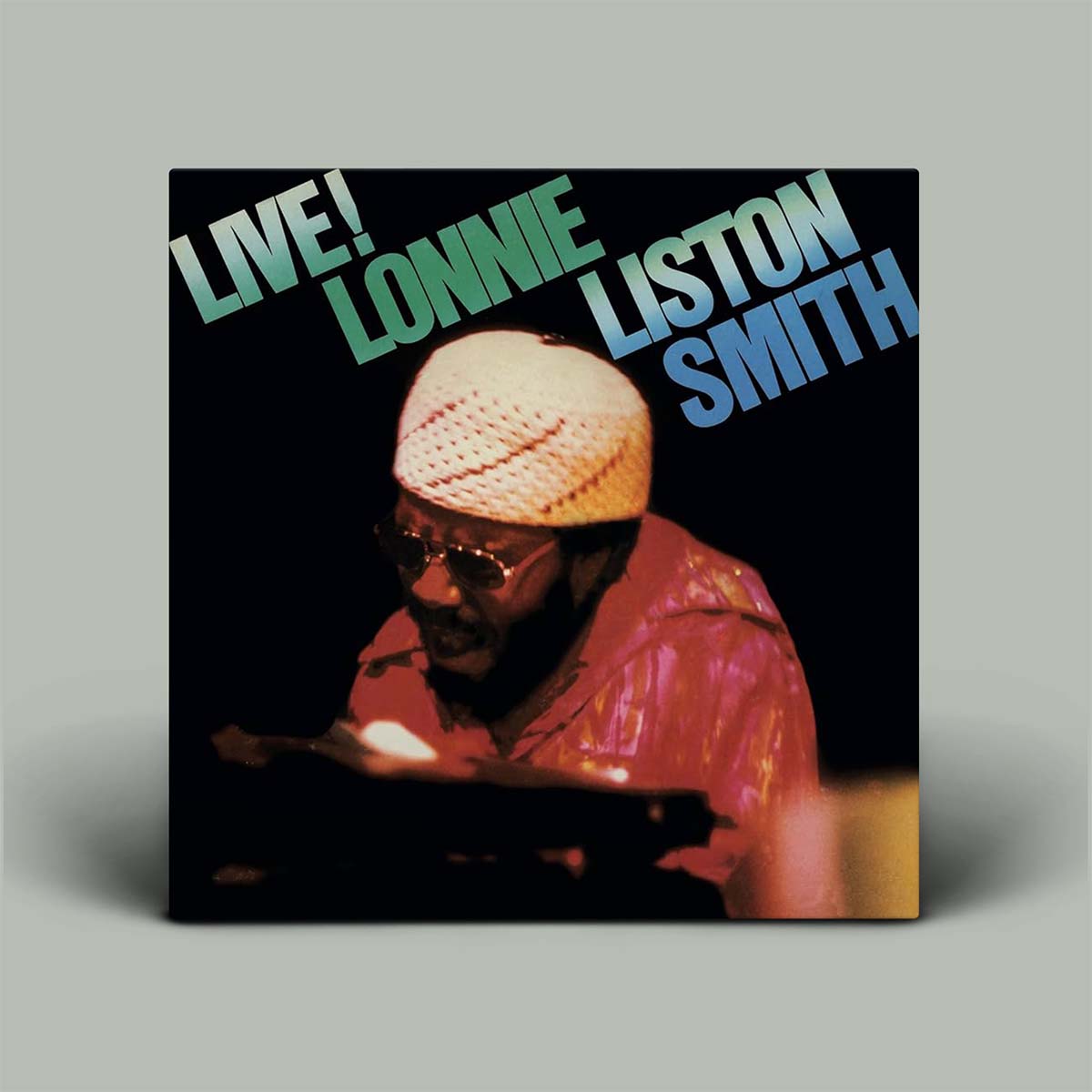 Album cover with photo of Lonnie playing keyboard with words Live! Lonnie Liston Smith on it.