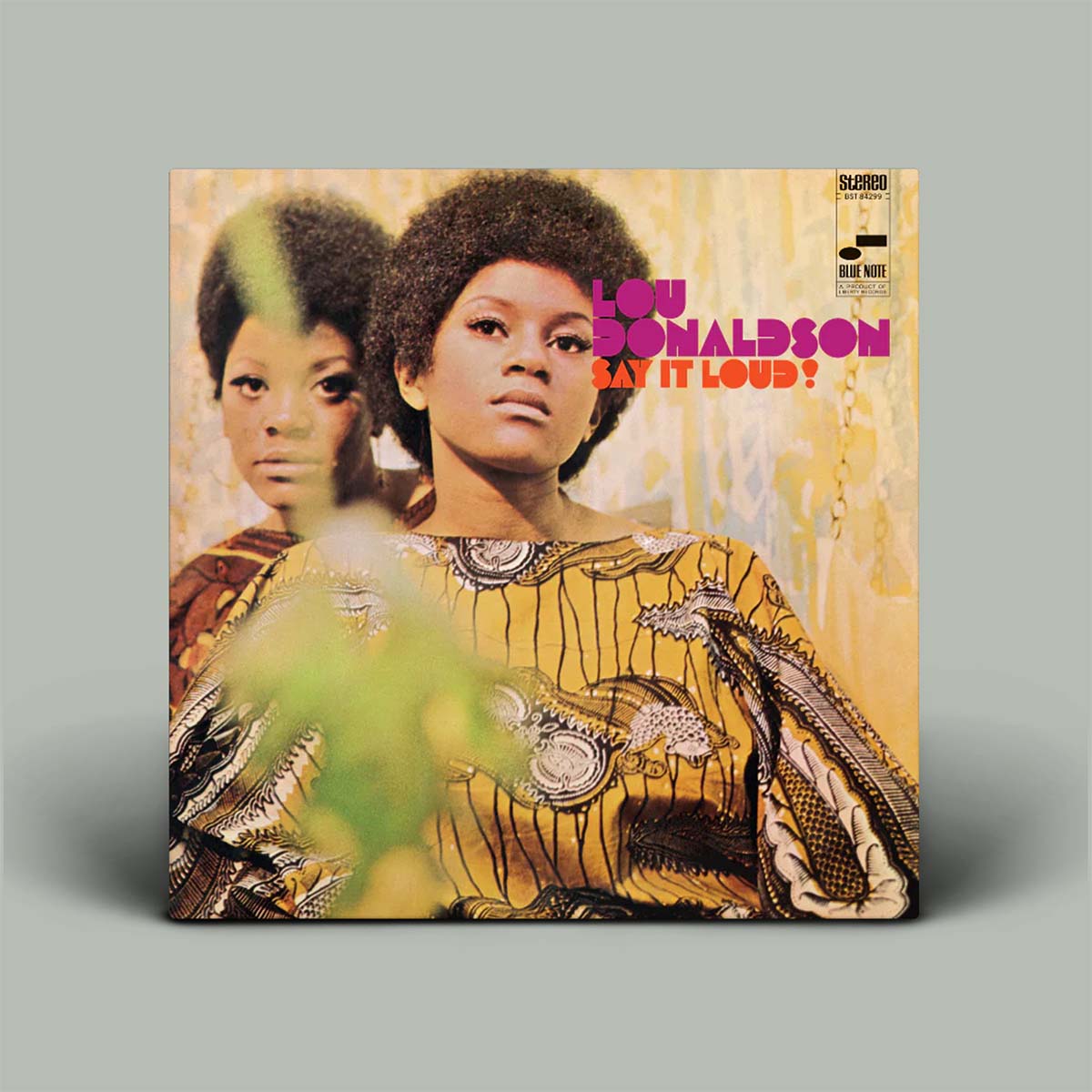 Album cover with photo of two women with album title written in pink and orange.