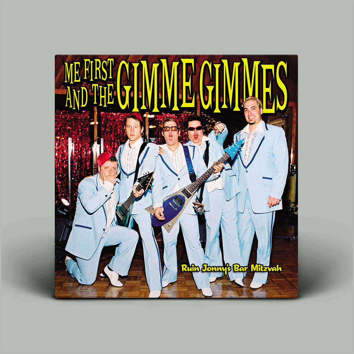 Album cover for 'Me First and the Gimme Gimmes' with a group of people in suits and guitars.
