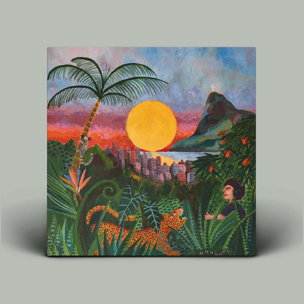 Album cover image of a tropical landscape with palm tree, cityscape, mountain, and leopard.