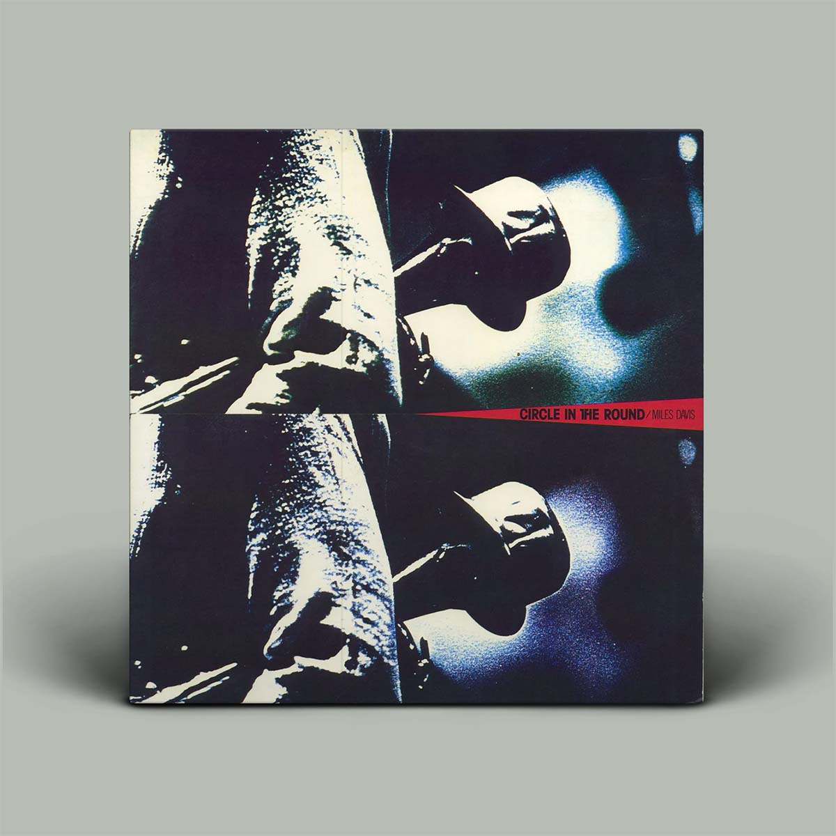 Album cover with a silhouette of a person holding a guitar on a gray background