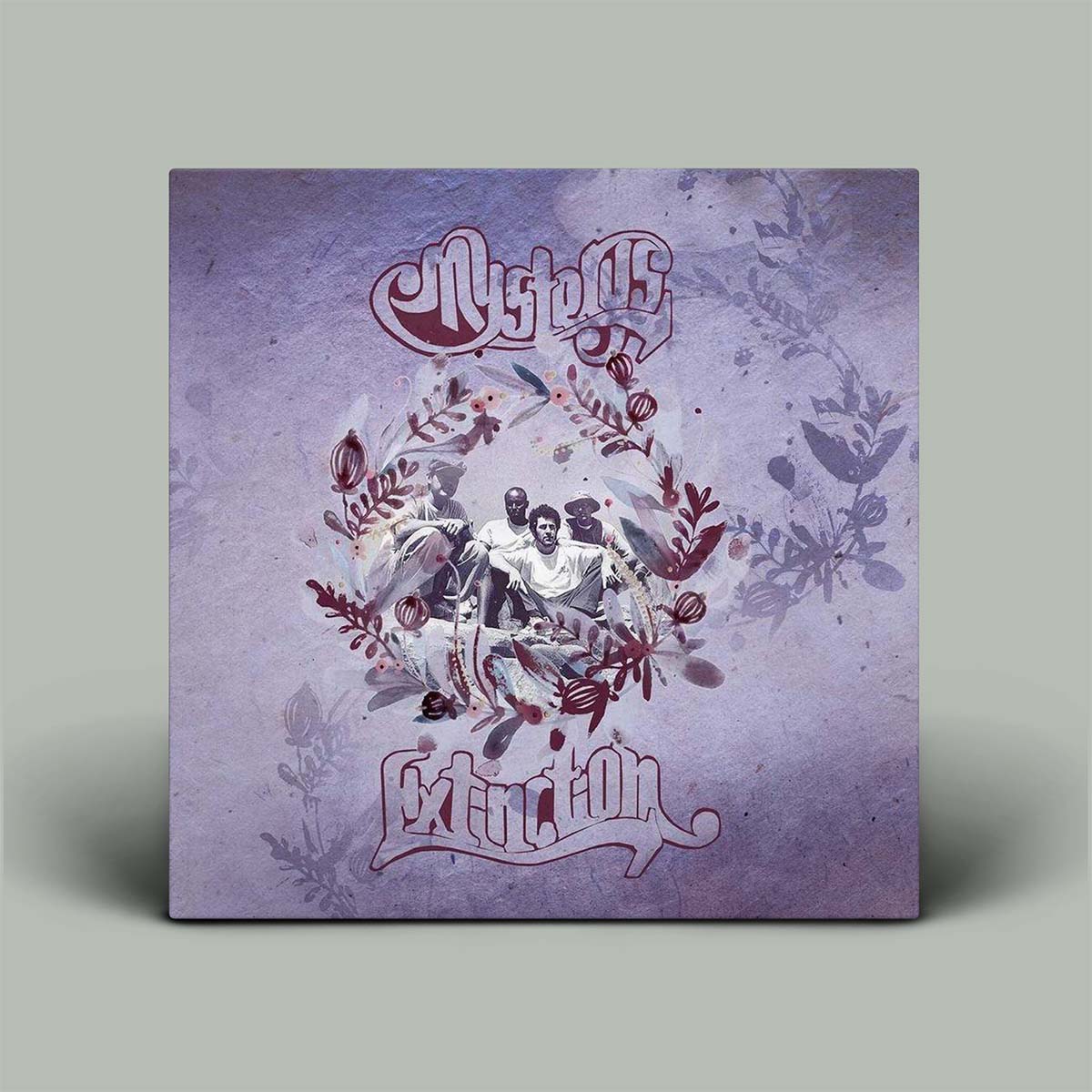 Purple album cover with writing and photograph of people in the middle.