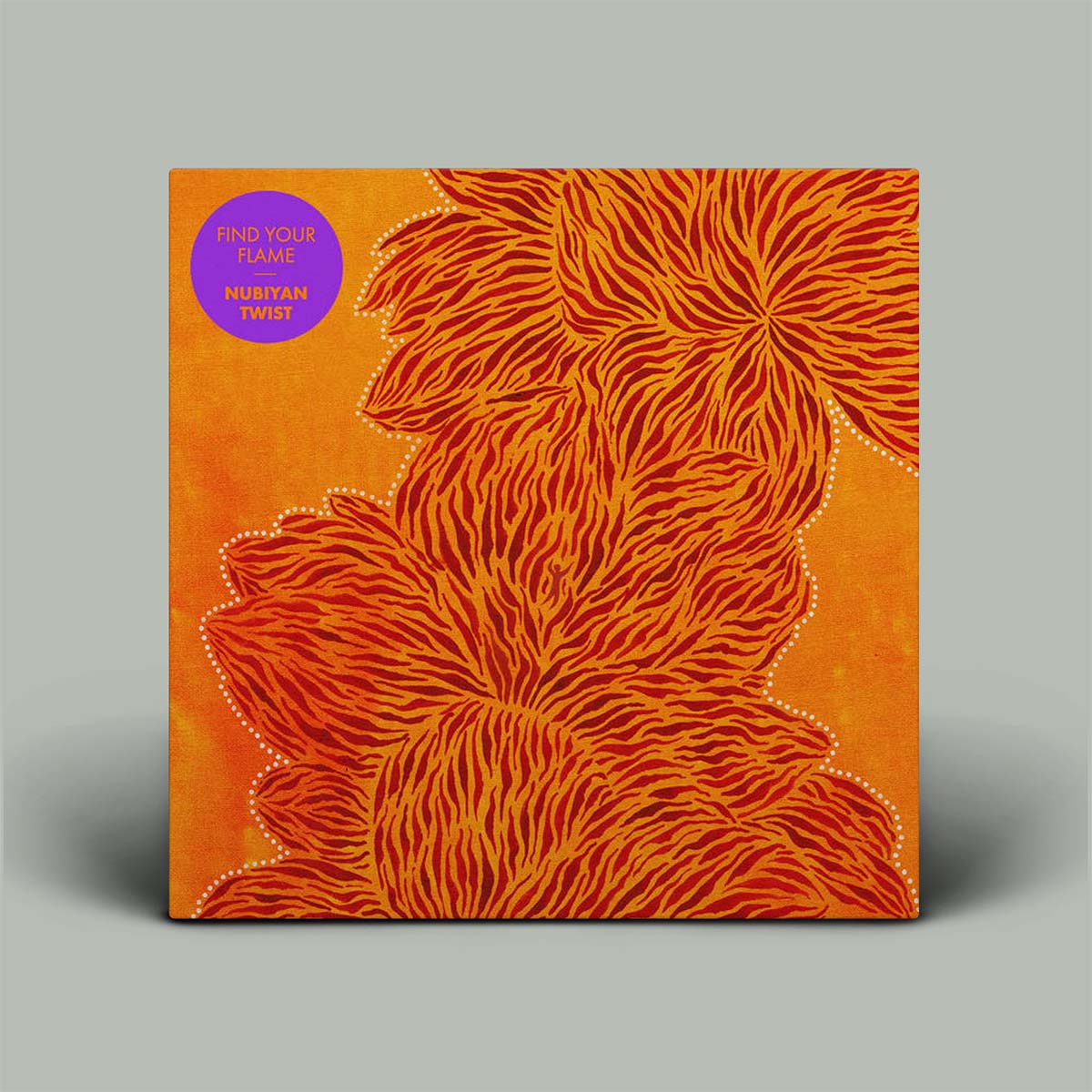 This image features the cover of "Find Your Flame," the fourth album by Nubiyan Twist. The album cover displays a vibrant and striking orange background with a detailed, abstract black and orange floral design that seems to move and dance, giving a sense of motion and energy.