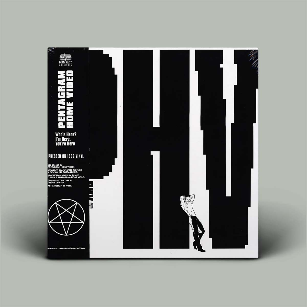 Vinyl record packaging with black and white design on a gray background