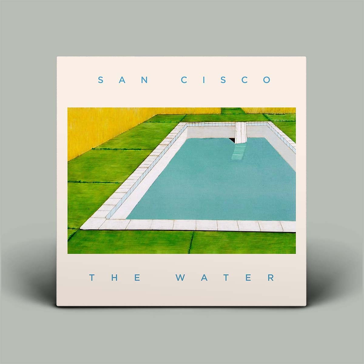 Album cover with an image of a pool and grassy area, titled 'San Cisco: The Water' on a gray background.