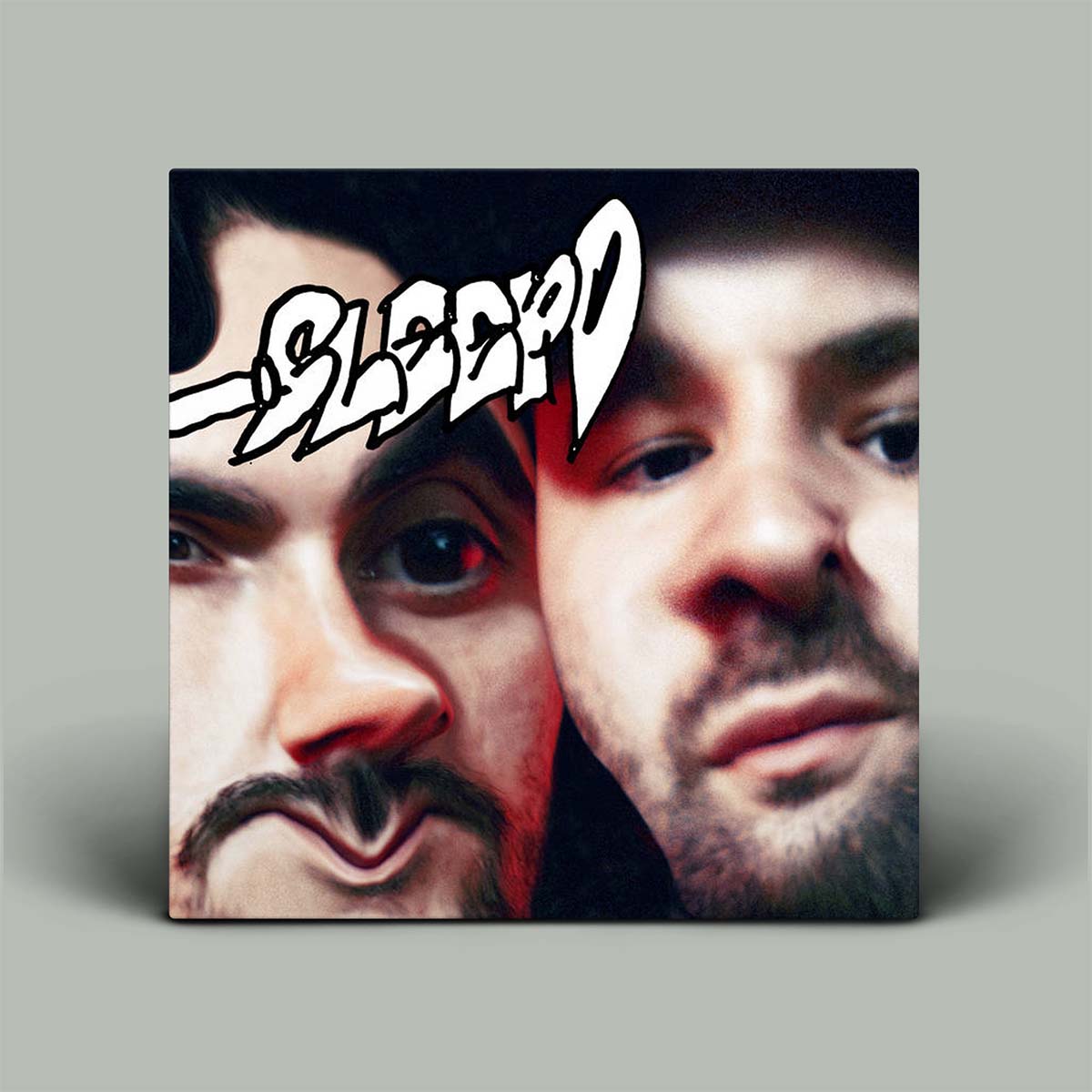 Album cover with two faces and the word 'Sleazy' on a gray background