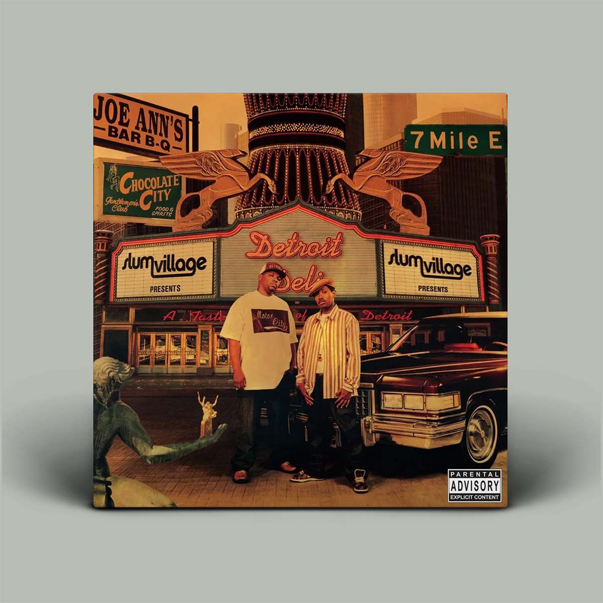 Album cover with two people standing in front of vintage cars and signs, featuring a 'Parental Advisory' label.