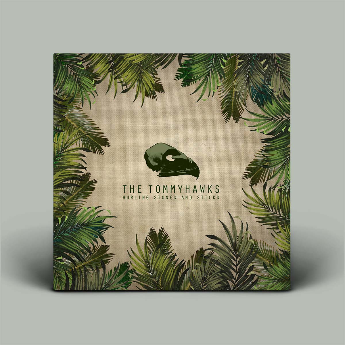 Album cover with green leaf pattern and 'The Tommyhawks' text on a beige background