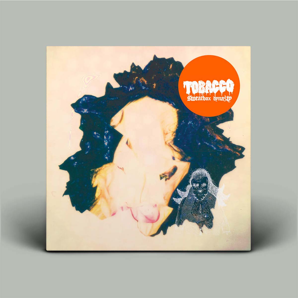 Vinyl record cover with a stylized face and 'Tobacco' logo on a gray background