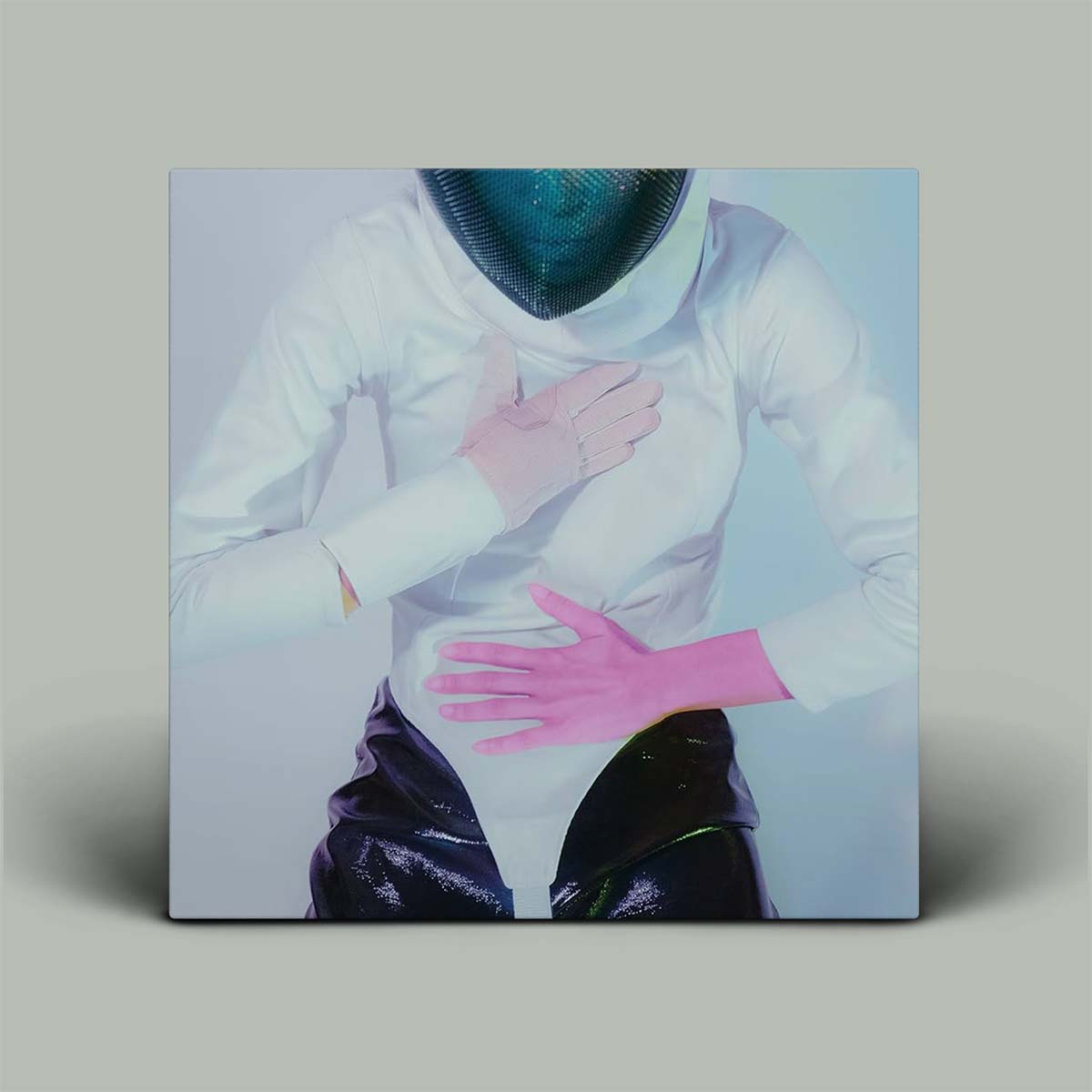 Person wearing a white outfit with a blue helmet and pink gloves on a gray background