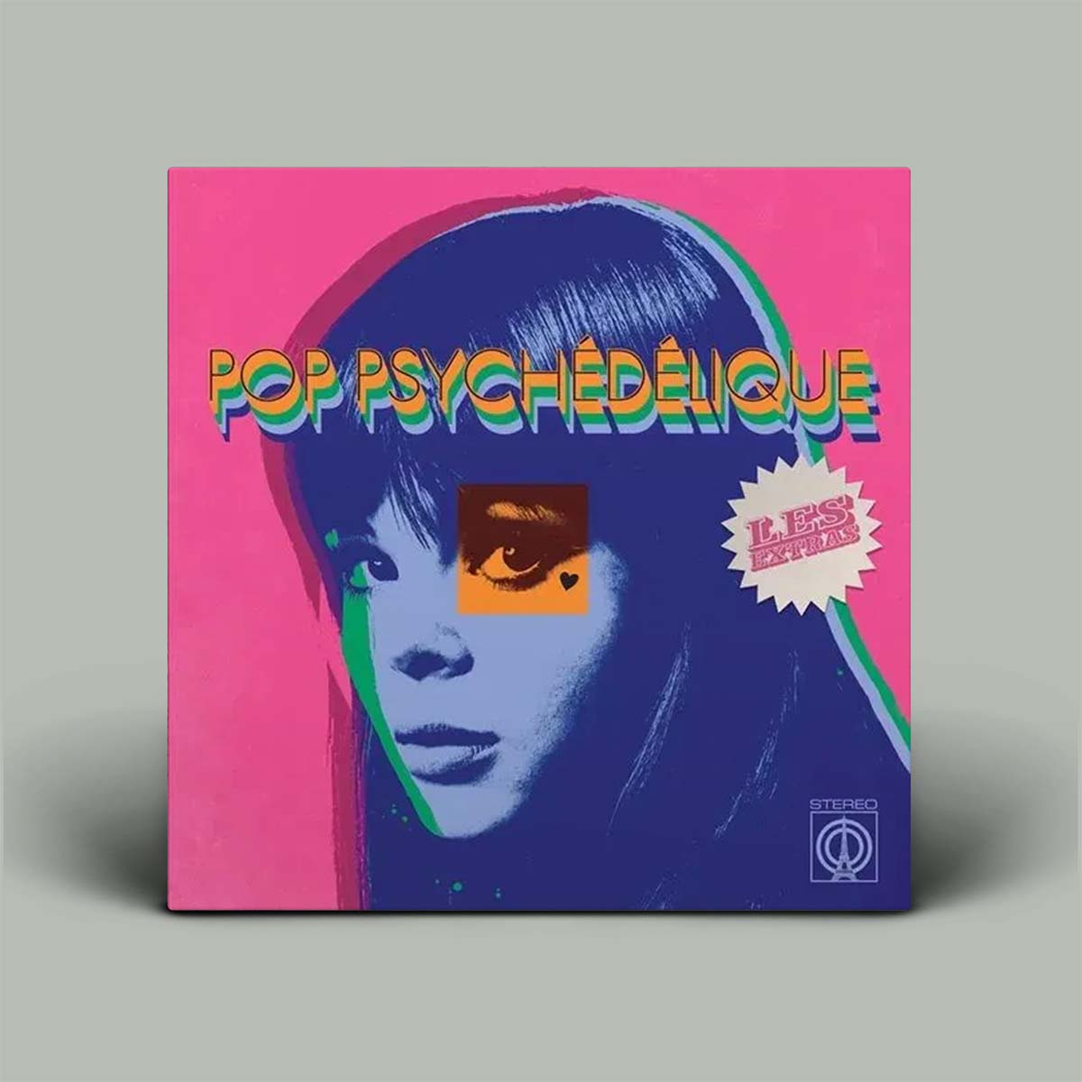 Vinyl record cover with a stylized face and colorful text on a pink background