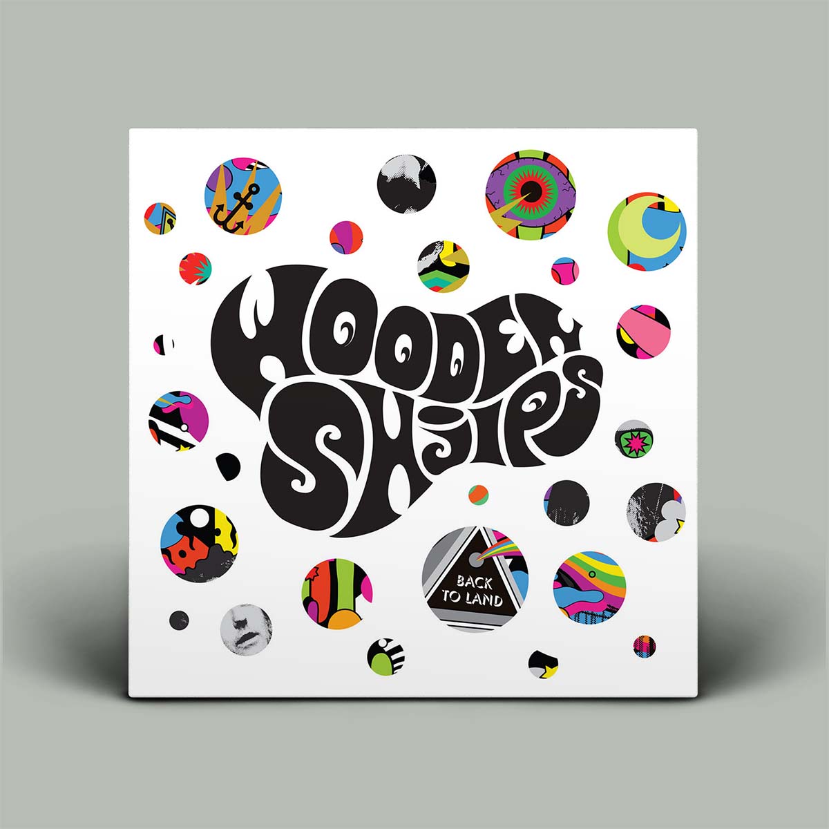 Album cover with colorful circular designs and 'Wooden Shjips' text on a white background