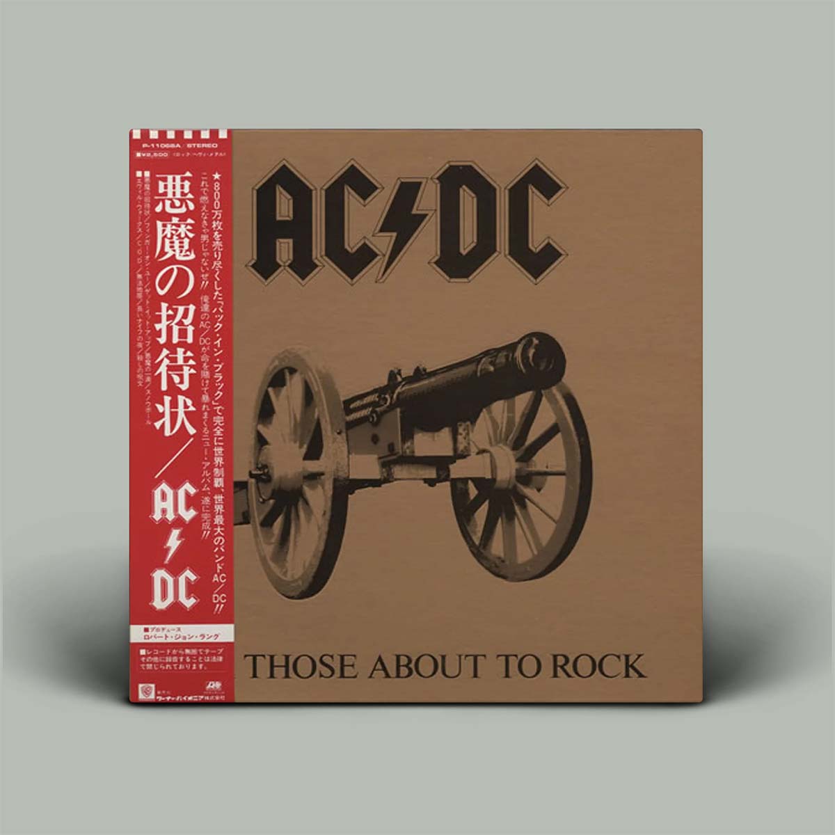 AC/DC album cover with a cannon illustration on a brown background