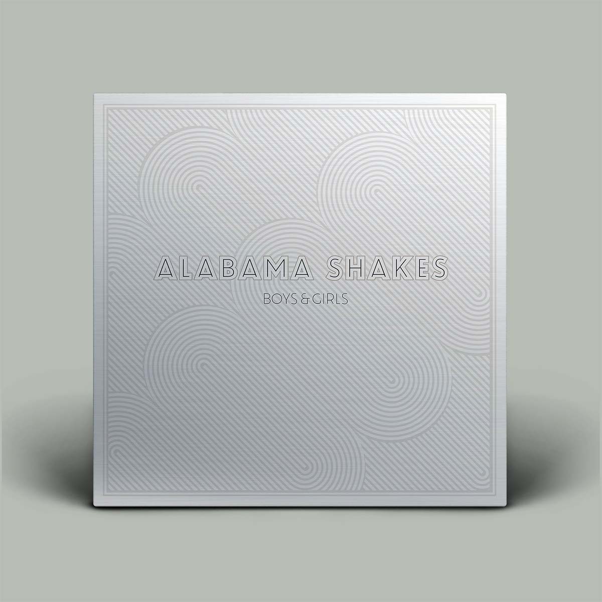 The album cover for Alabama Shakes' 'Boys & Girls' is shown as a square package with a textured, embossed silver-white design on a solid gray background.