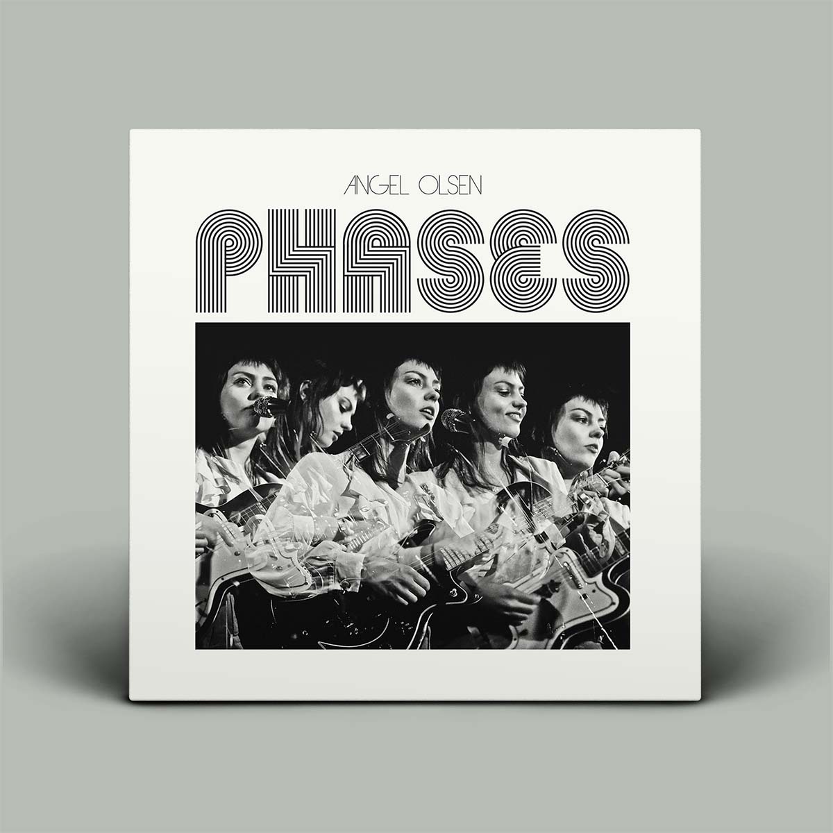 Album cover for 'Phases' by Angel Olsen with a black and white photo of a woman playing guitar.