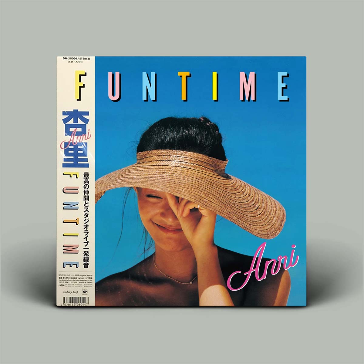 A vinyl record album cover for Anri's 'FUN TIME' Japanese release, featuring a woman in a large straw hat against a bright blue background, shown standing upright on a neutral gray background.