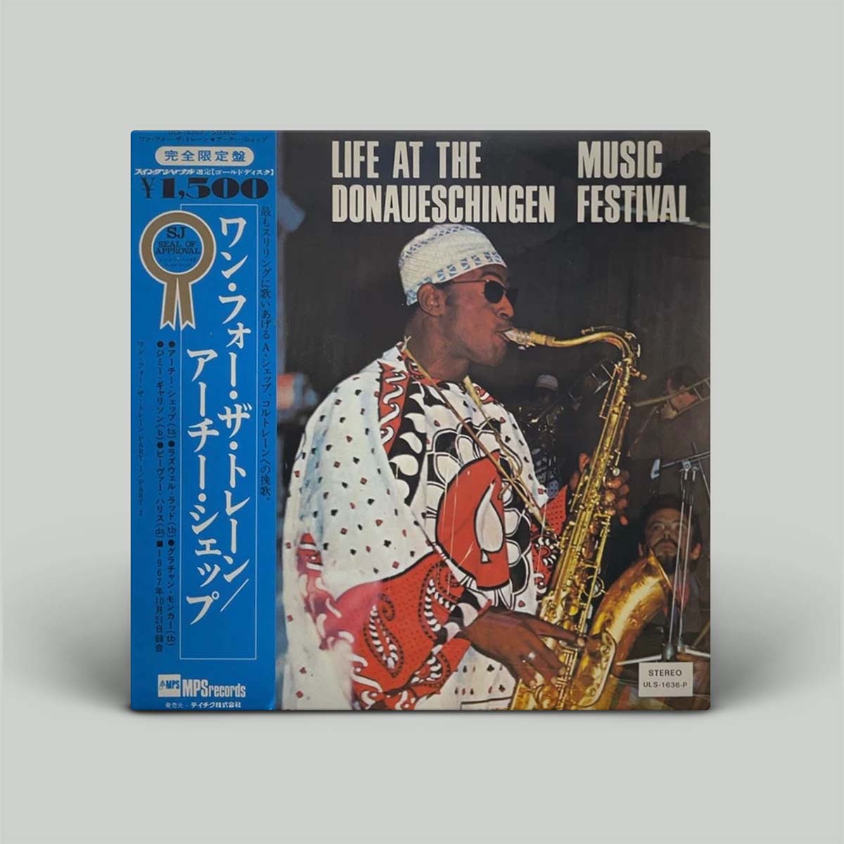 A vinyl record album cover for 'Life at the Donaueschingen Music Festival' by Arto Thiersen, featuring a blue Japanese obi strip on the left and a photo of the saxophonist on the front, set against a plain light gray background.