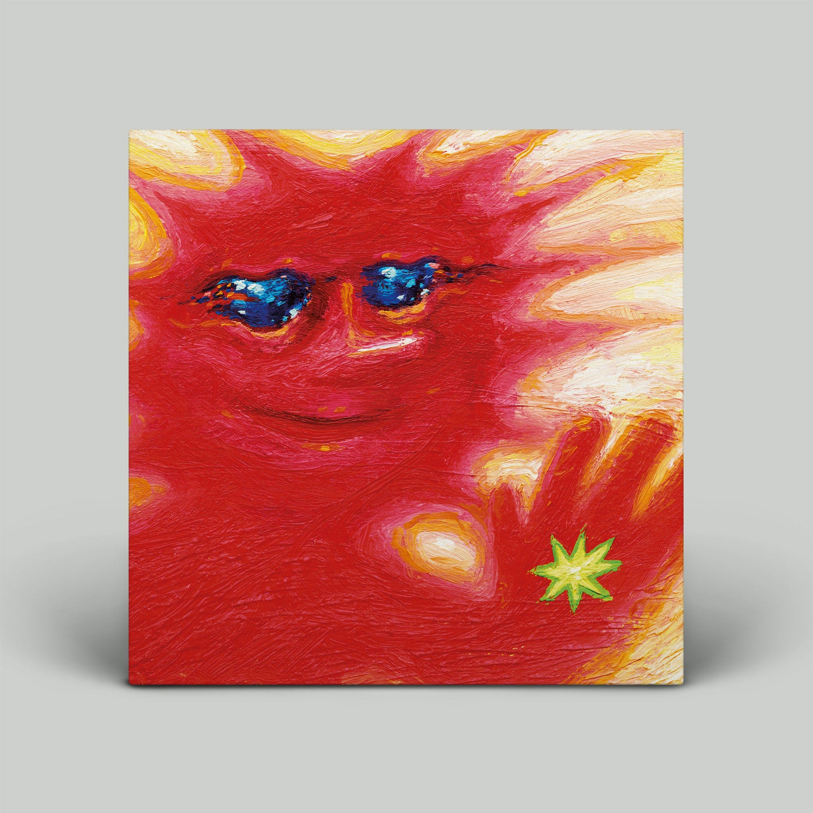 Abstract painting of a face with red, yellow, and blue colors on a gray background