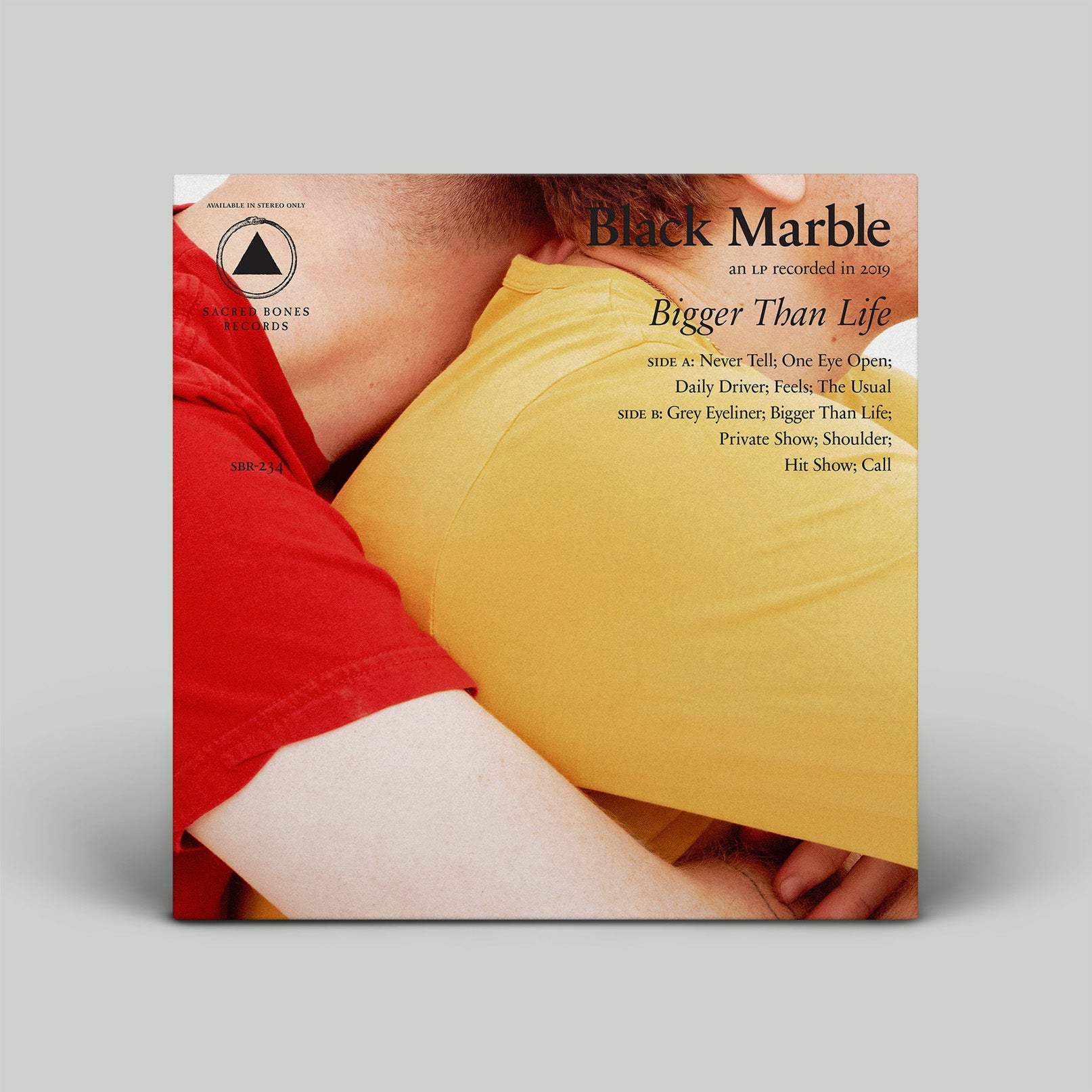 Vinyl record cover with two people embracing, featuring the title 'Black Marble' and album tracklist.