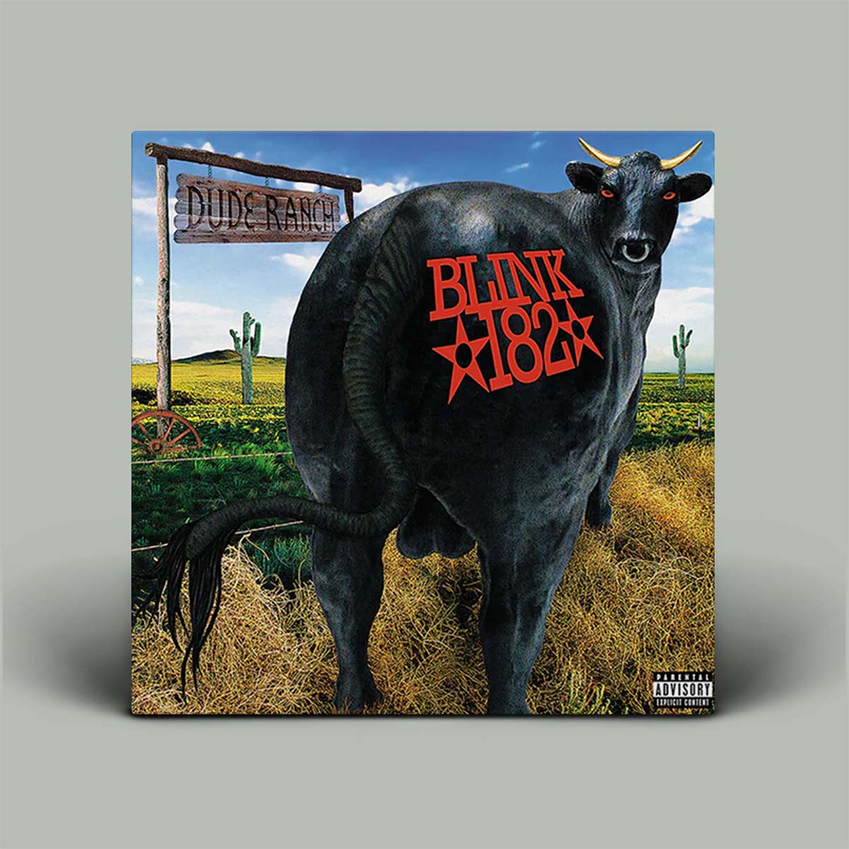Vinyl record cover with a bull and 'Blink 182' logo, set against a ranch background.