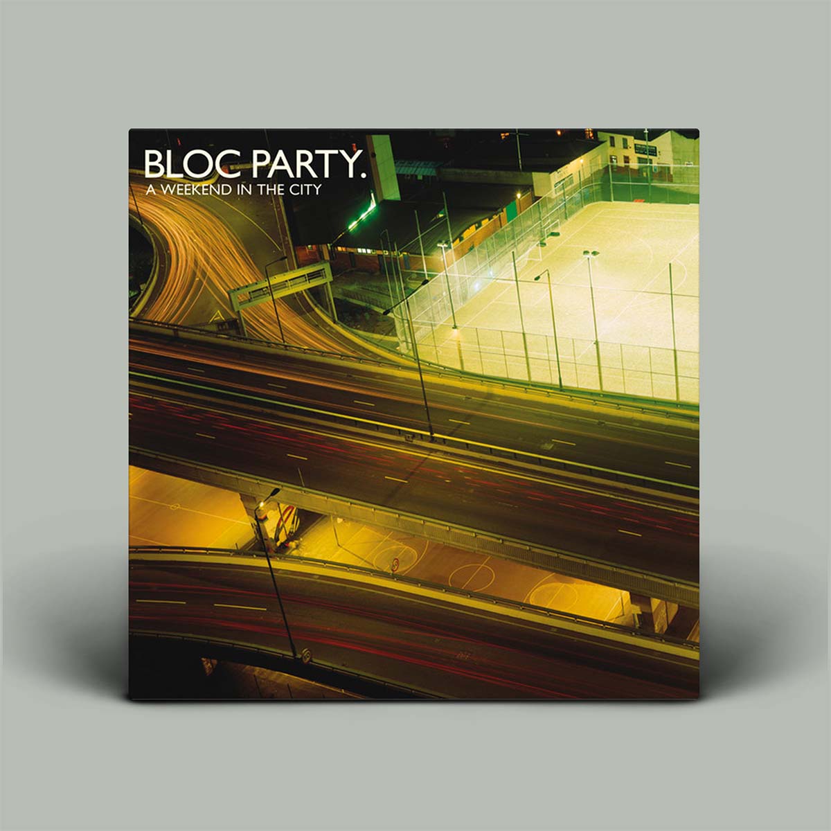 Album cover for Bloc Party's 'A Weekend in the City' with a cityscape at night.