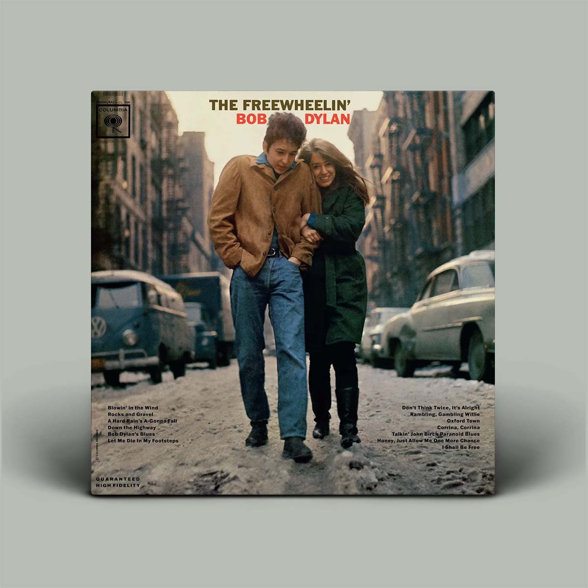 Photo of man and woman hugging while walking down street