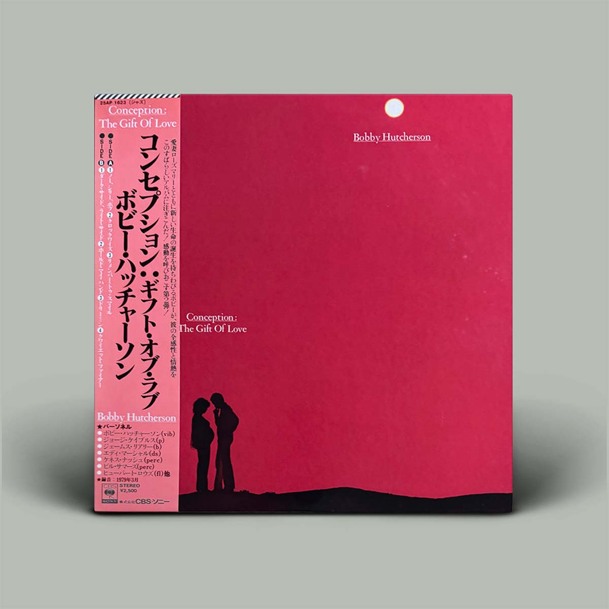 Bobby Hutcherson 'The Gift of Love' vinyl record album cover, featuring a vibrant pink cover with black silhouette artwork of a couple and a black spine band with Japanese text.