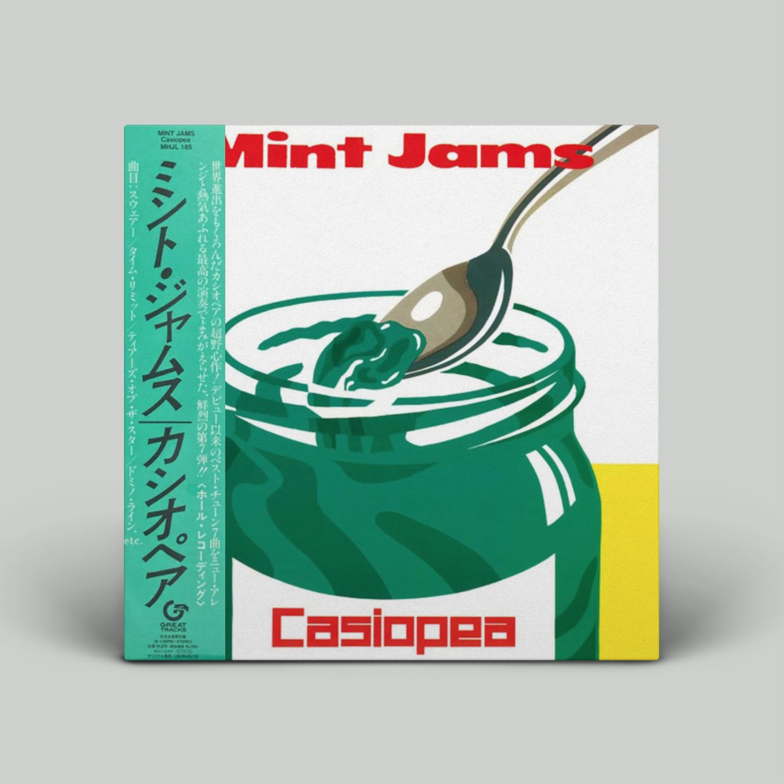 Casiopea Mint Jams packaging with a jar of mint jelly and a spoon on a gray background