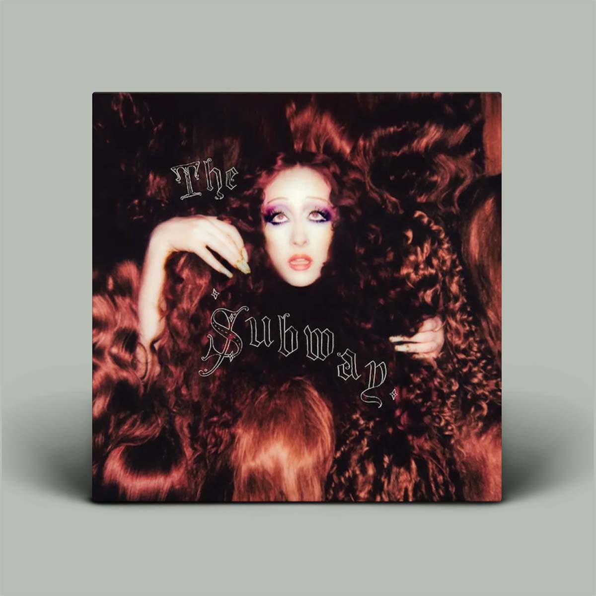 Album cover with photo of woman surrounded by red hair.